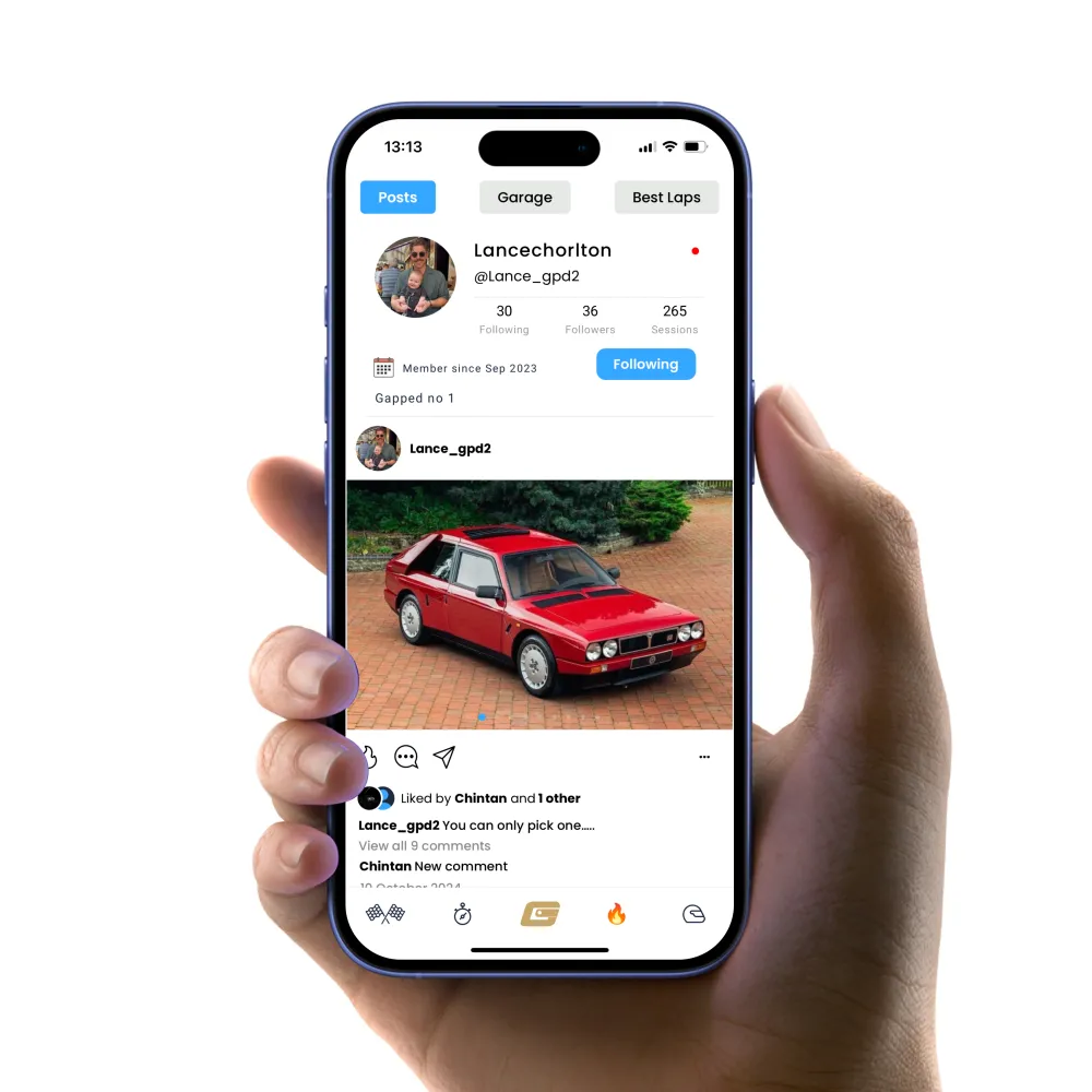 A hand holding an iPhone with a social media feed displayed A hand holding an iPhone with a social media feed displayed