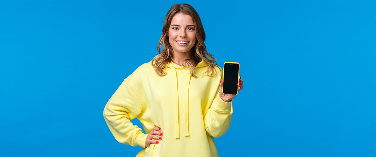 lady holding a phone, symbolic of app store use