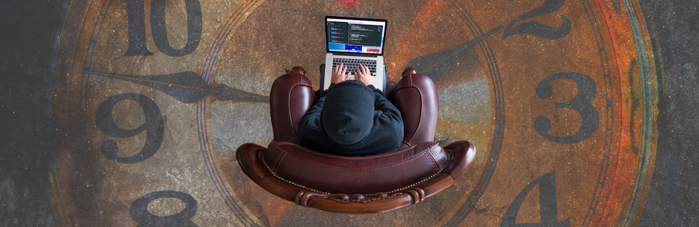 person developing code, sat on-top of a clock-face. Symbolic of development time.